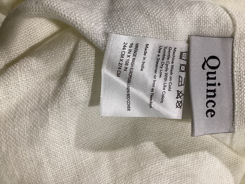 Condition photo showing As Is for 96” x 108” quince vintage wash european linen bed cover