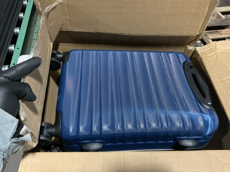 Condition photo showing Good Condition for amazon basics 21" hardside carry-on luggage, hardshell suitcase with wheels, expandable for up to 25% more space, with scratch-resistant surface, four multi-directional wheels, navy blue navy blue carry-on