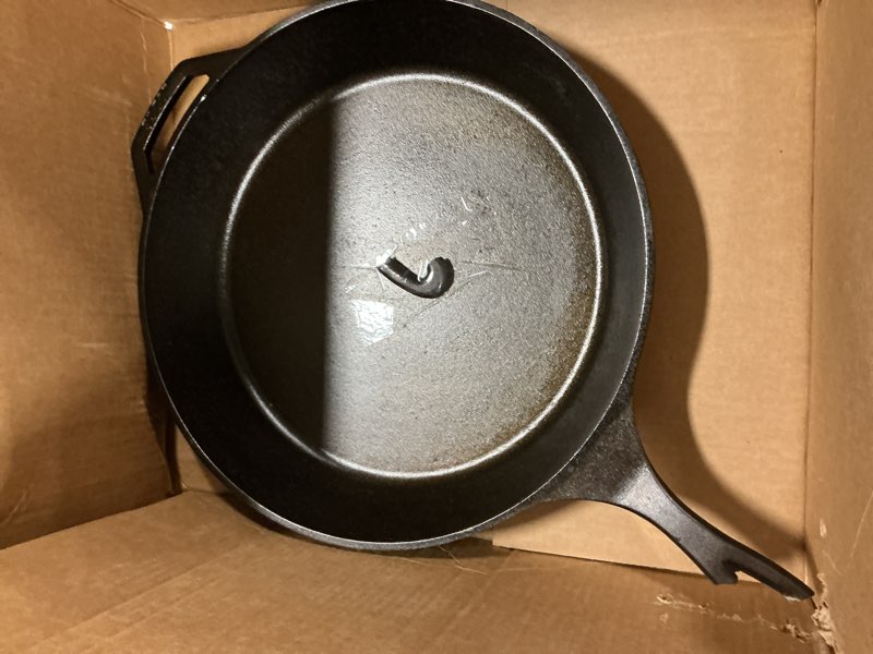 Condition photo showing As Is for Lodge 15 Inch Cast Iron Pre-Seasoned Skillet – Signature Teardrop Handle - Use in the Oven, on the Stove, on the Grill, or Over a Campfire, Black