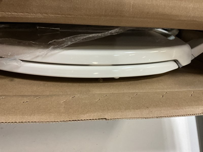 Condition photo showing As Is for Kohler K-20110-0 Brevia Elongated Toilet Seat with Grip-Tight Bumpers, Quiet-Close Seat, Quick-Attach Hardware, White