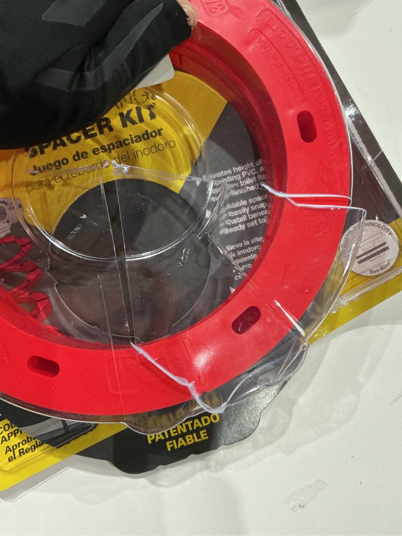 Condition photo showing As Is for 1/8 in. - 3/4 in. toilet flange spacer kit