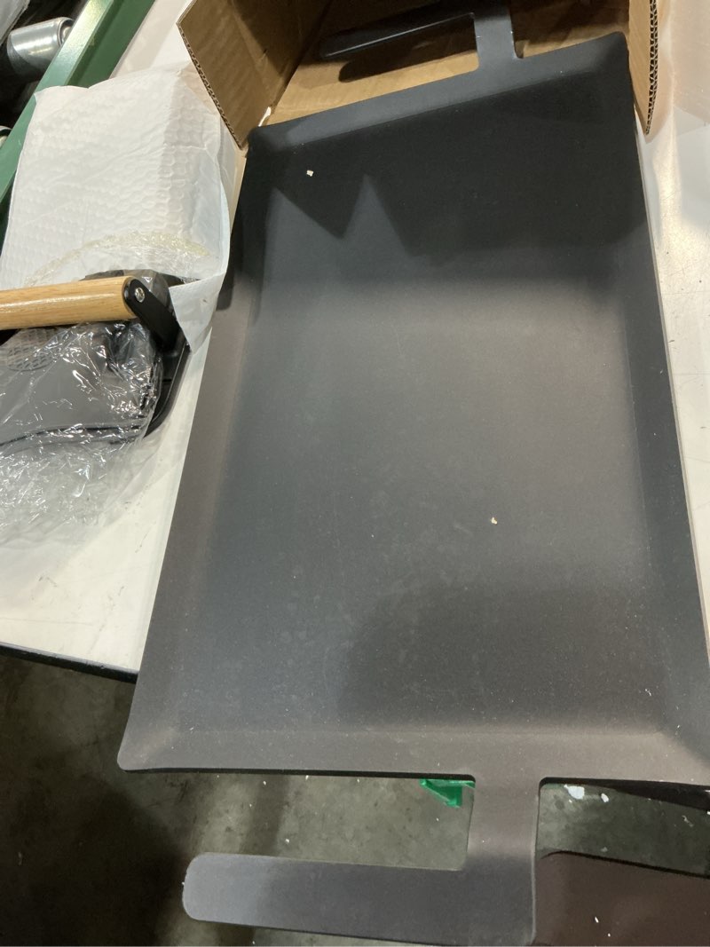 Condition photo showing As Is for carbon steel griddle comes with grill press, double burner griddle for gas stove, electric range, outdoor gas grill, induction, and oven, pre-seasoned nitride coating compatible with made in