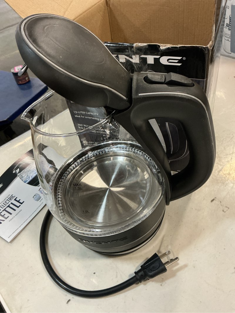 Condition photo showing As Is for OVENTE Electric Kettle, 1.5L Borosilicate Glass Countertop Water Heater and Boiler for Coffee or Tea, BPA-Free, Auto Shut-Off, Boil-Dry Protection, Removable and Washable Spout Filter, Black KG83B