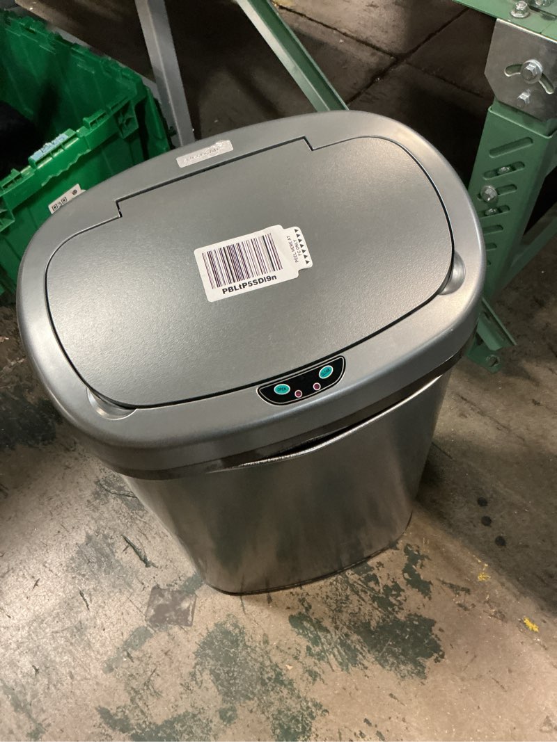 Condition photo showing As Is for sensorcan 13 gallon stainless steel touchless trash can with absorbx odor filter and removable wheels