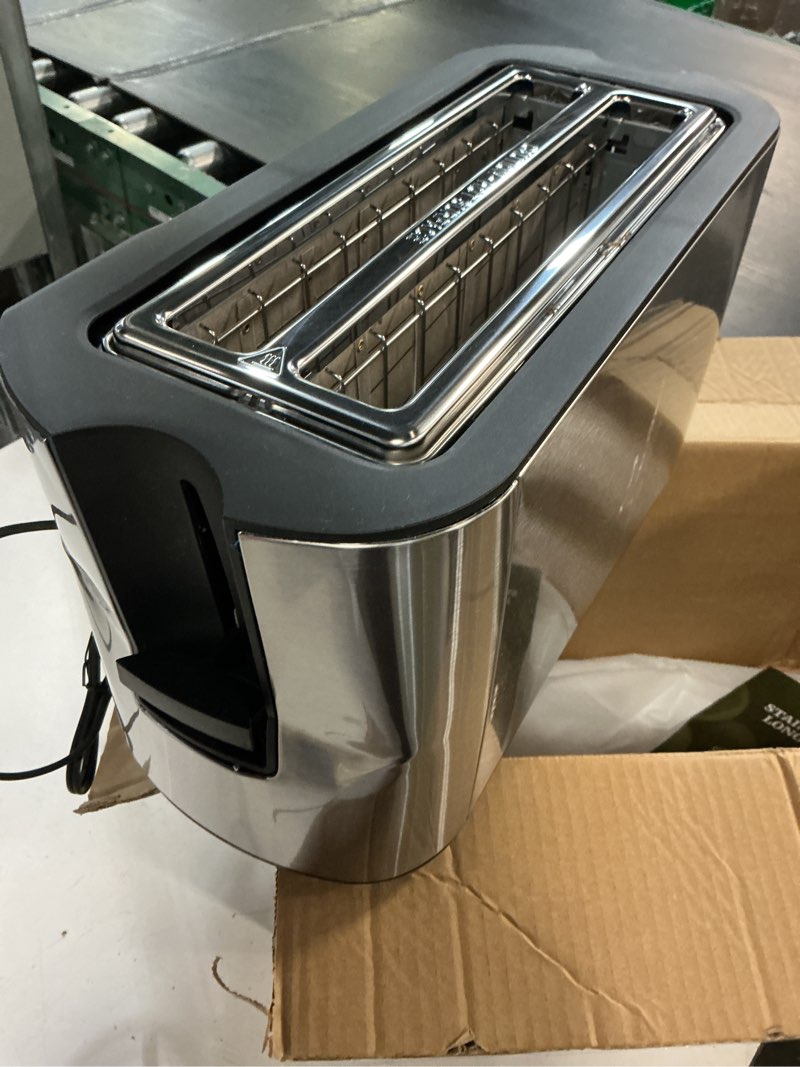 Condition photo showing As Is for elite gourmet ect-3100 4-slice long slot toaster | extra wide slots for bagels, sourdough & texas toast | 6 browning settings | reheat, defrost & cancel | built-in warming rack | stainless steel 4 slice black/stainless steel