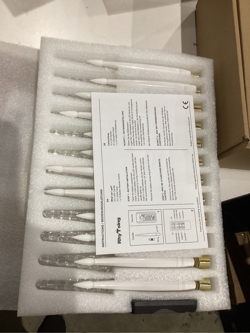 Condition photo showing New/Like New for Rhytsing 12 Pcs Christmas Tree Candles with Crystal Icicle Hooks and Remote, Battery Operated LED Taper Candles with Timer for Christmas Tree and Mantel Garland Decor Christmas LED Candles with Icicle Hooks - 12pcs
