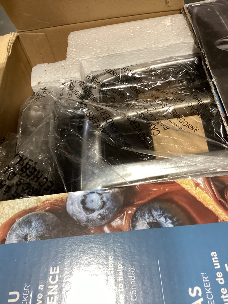 Condition photo showing New/Like New for black+decker 4-slice toaster, tr1410bd, extra-wide, 7 shade settings, crumb trays, gloss black black toaster