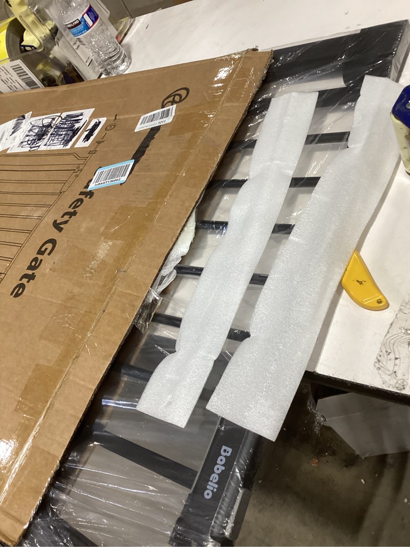 Condition photo showing As Is for BABELIO Baby Gate for Doorways and Stairs, 31-36" Pet Gate with Wide Walk Thru Door and Lock Indicat