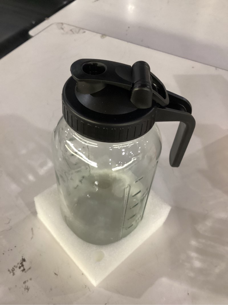Condition photo showing Good Condition for 64 oz mason jar pitcher – airtight & leakproof glass pitcher with lid, perfect for iced tea, sun tea, cold brew, breastmilk, 2 quart (1/2 gallon) mason jar with pour spout lid flip-cap & handle black 64 ounces 1