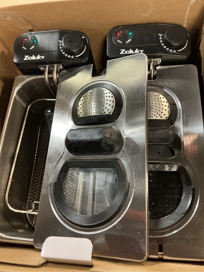 Condition photo showing As Is for deep fryer, 7.4 quart oil capacity with 2 baskets for home use, powerful 3000w with adjustable temperature, lid with viewing window and odor free filter, removable oil filtration, stainless steel
