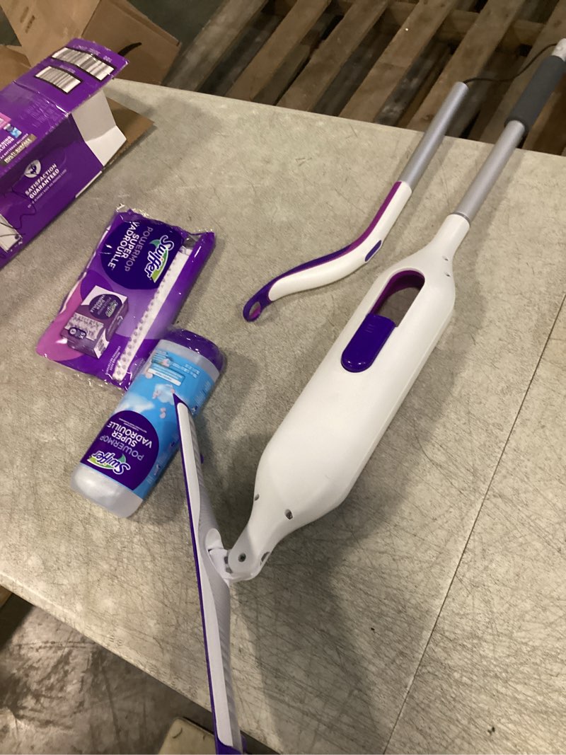 Condition photo showing New/Like New for swiffer powermop multi-surface mop kit for floor cleaning, fresh scent, mopping kit includes powermop, 2 mopping pad refills, 1 floor cleaning solution with fresh scent and 2 batteries purple and white