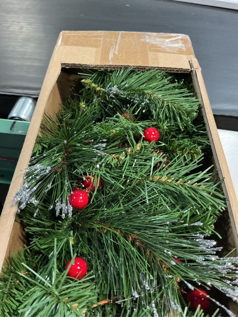 Condition photo showing New/Like New for national tree company 9 ft pre-lit crestwood spruce artificial christmas garland, christmas decoration with glitter, pinecones, red berries, 50 clear lights, 180 tips, green plug in tree