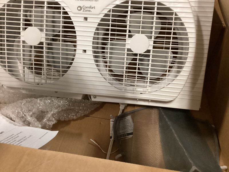 Condition photo showing As Is for comfort zone window fan for bedroom, 9 inch 3 speed dual fans with auto-locking expanders, window exhaust fan, removeable bug screen, white white 3-speed