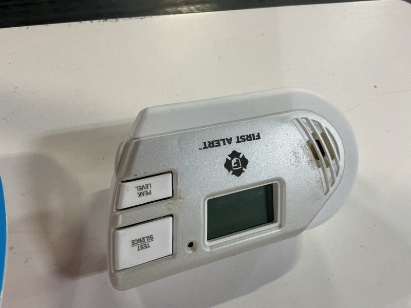 Condition photo showing As Is for first alert plug-in electrochemical explosive gas and carbon monoxide detector