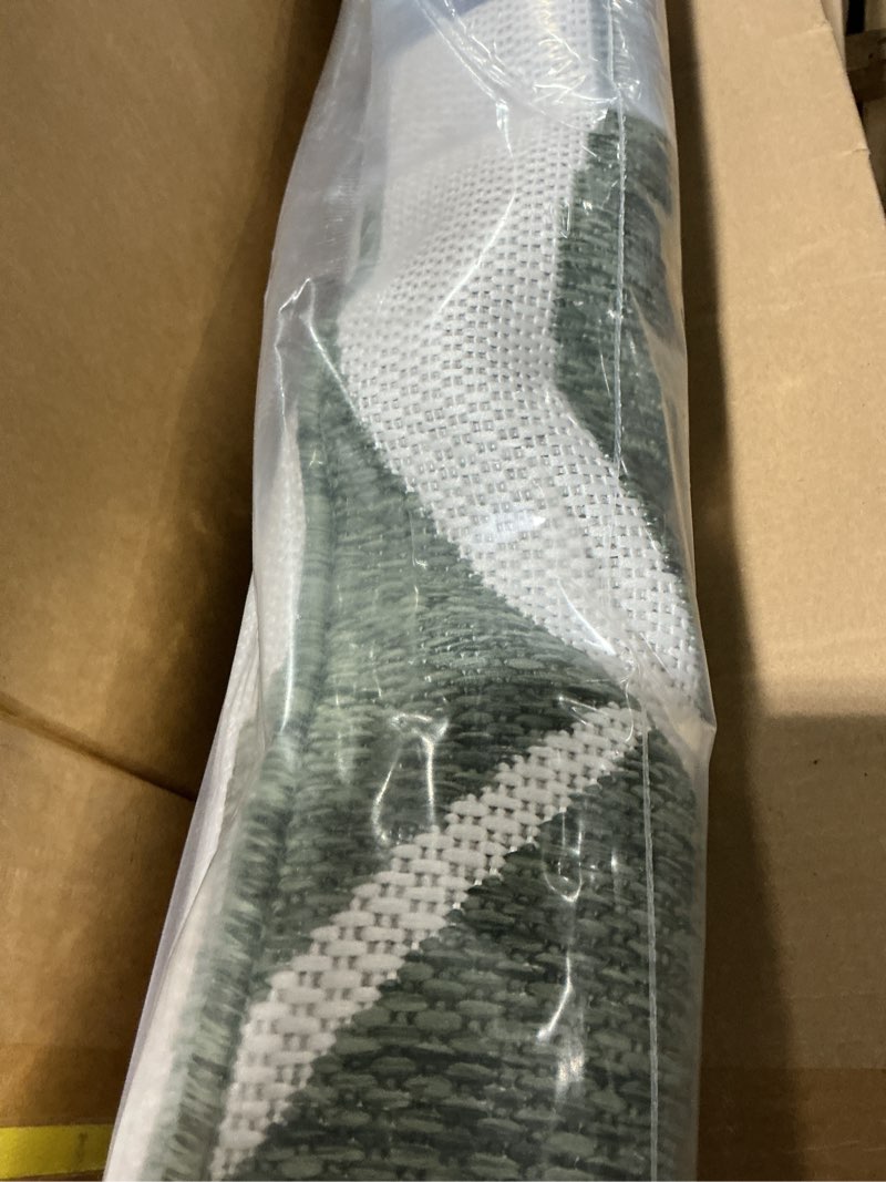 Condition photo showing New/Like New for tommy bahama patio country botanical coastal indoor/outdoor area rug, green/cream, 7'10"x10'2" green/cream 6'7" x 9'2" (rectangular)