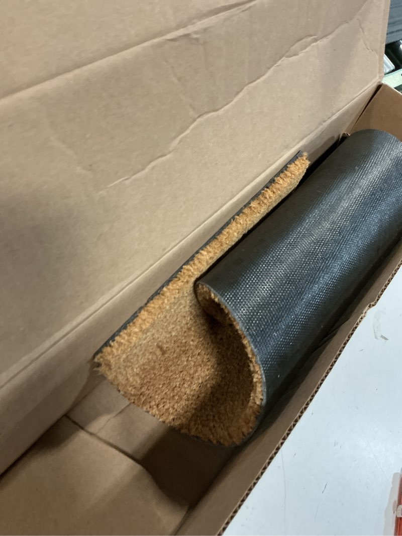 Condition photo showing As Is for calloway mills 153551224 natural coir with vinyl backing doormat, 12" x 24" 1' x 2' (rectangular)