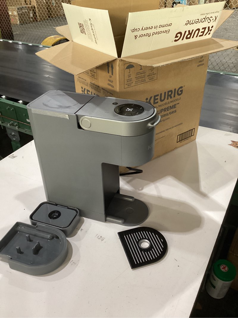 Condition photo showing As Is for keurig k-supreme single serve k-cup pod coffee maker, multistream technology, 4 brew sizes, 66oz dual-position removable reservoir, gray gray coffee maker
