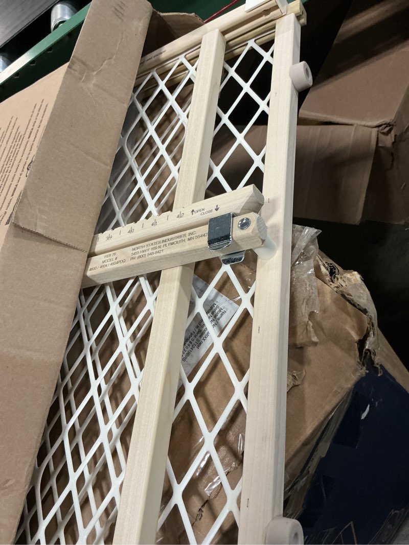 Condition photo showing As Is for toddleroo by north states diamond mesh wooden baby gate: 26.5"- 42" wide. pressure mounted baby gate for doorway. (23" tall, sustainable hardwood)