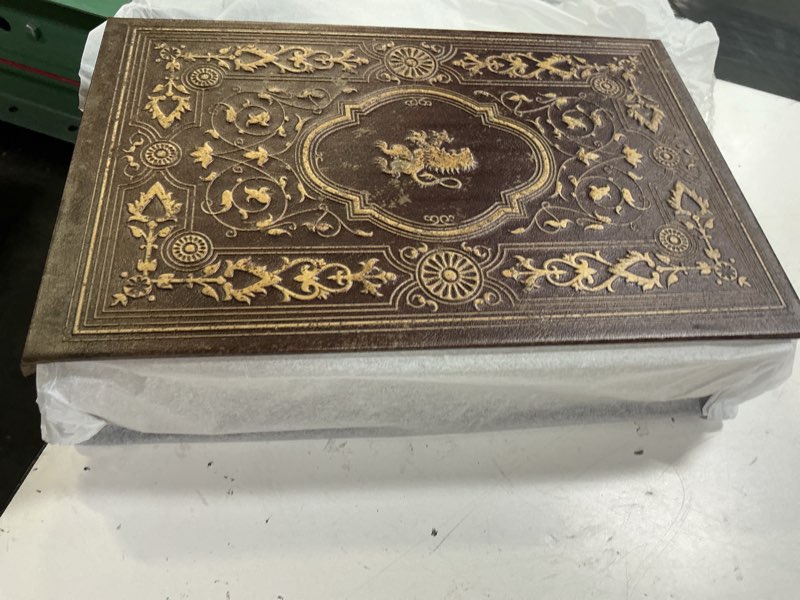 Condition photo showing Good Condition for faux leather decorative book storage box with embossed lion crest, vintage look hidden keepsake box for jewelry, letters & valuables, elegant home office shelf decor (reddish brown) lion badge
