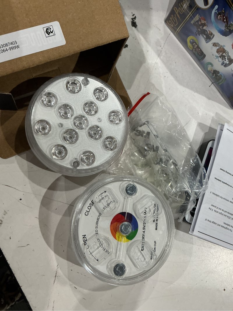 Condition photo showing Good Condition for merkury innovations rgb led submersible puck lights with remote control, 2 pack