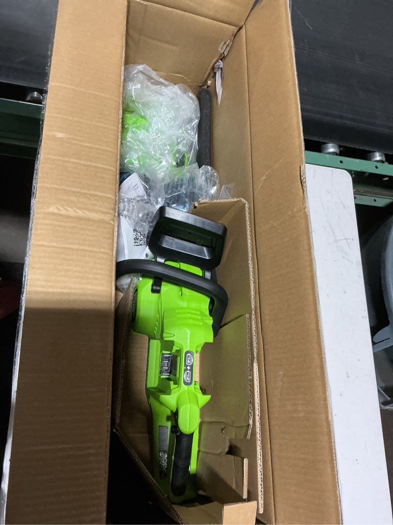 Condition photo showing Good Condition for greenworks 48v (24v x 2 ) 16" brushless cordless chainsaw (great for tree felling, limbing, pruning, and firewood / 200+ compatible tools), (2) 4.0ah batteries and dual port rapid charger included 16" (2 x 4.0ah)