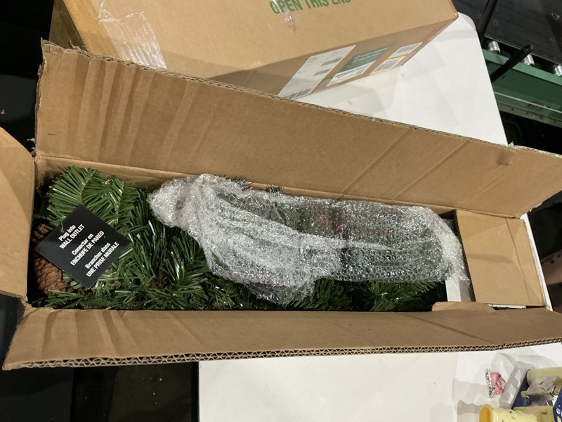 Condition photo showing Good Condition for national tree company 9 ft pre-lit crestwood spruce artificial christmas garland, christmas decoration with glitter, pinecones, red berries, 50 clear lights, 180 tips, green plug in tree