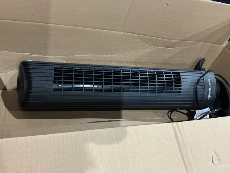 Condition photo showing As Is for amazon basics 28" 60-degree oscillating tower fan with powerful airflow for bedroom, living room, office, 3 speeds, mechanical control, air circulator, 35w, 27.8"h x 9.4"d x 9.4"w, black 28" - mechanical control