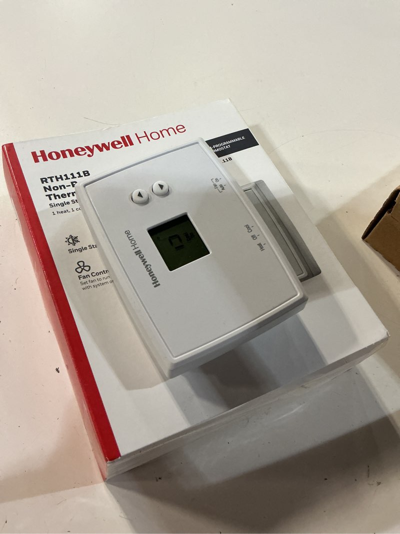 Condition photo showing As Is for honeywell home rth111b digital non-programmable thermostat