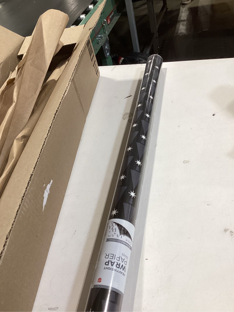 Condition photo showing Good Condition for American Greetings Reversible Modern Black Christmas Wrapping Paper Roll, White, Silver, and Black Holiday Gift Wrap (60 sq. ft., 1 Standard Roll Wrap-30 in. x 24 ft.) Fa La La and Trees Modern Black and Silver
