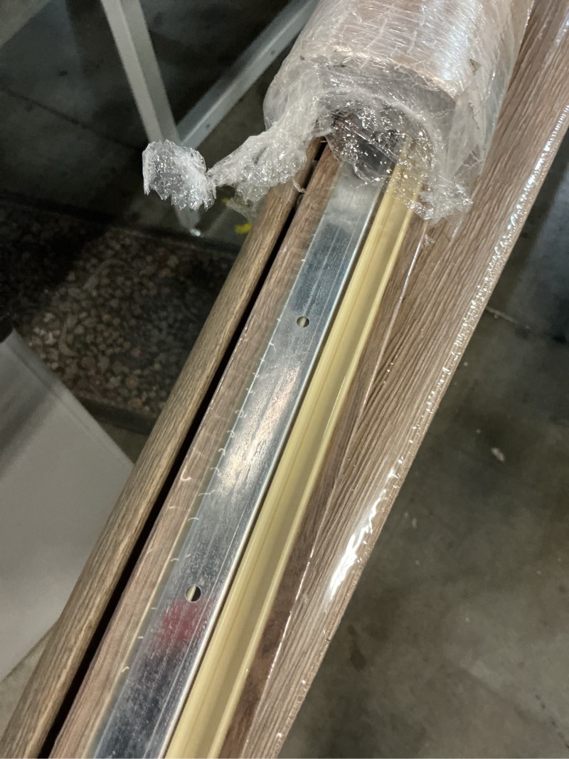 Condition photo showing As Is for century oak 0.25 in. t x 1.77 in. w x 94 in. l luxury vinyl end cap