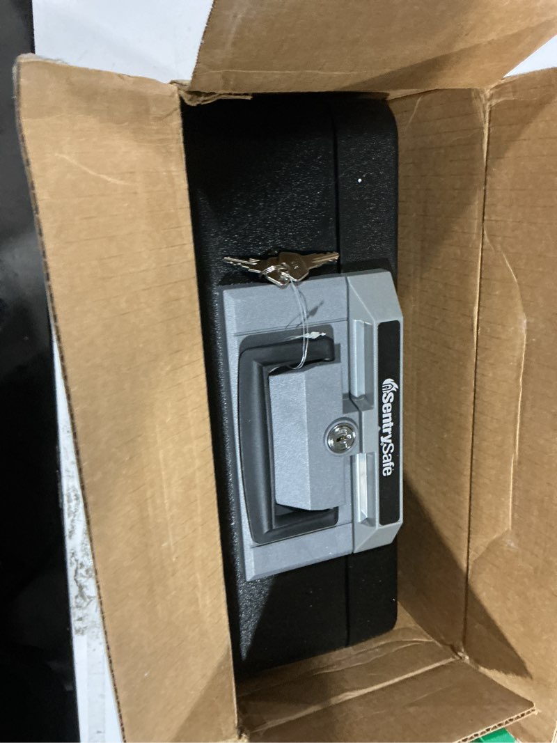 Condition photo showing Good Condition for sentrysafe fireproof safe box with key lock, chest safe with carrying handle to secure money, jewelry, documents, 0.25 cubic feet, 6.3 x 15.3 x 12.1 inches, 1160