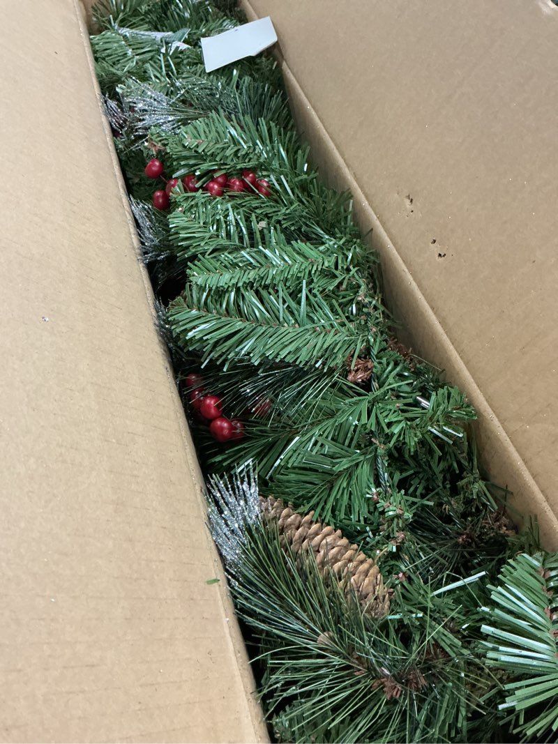 Condition photo showing New/Like New for national tree company 9 ft pre-lit crestwood spruce artificial christmas garland, christmas decoration with glitter, pinecones, red berries, 50 clear lights, 180 tips, green plug in tree
