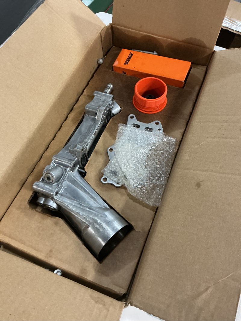 Condition photo showing As Is for Dorman 926-959 Patented Upgraded Aluminum Engine Oil Filter Housing with Oil Cooler and Filter Compatible with Select Models (OE FIX)