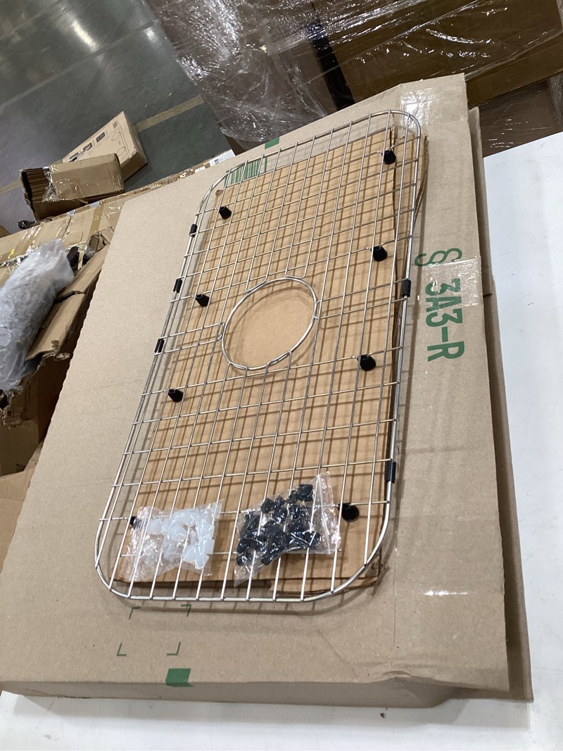Condition photo showing Good Condition for serene valley sink protector grid 26-1/16" x 14-1/16", centered drain with corner radius 3-1/2", 304 stainless steel material nlw2614c