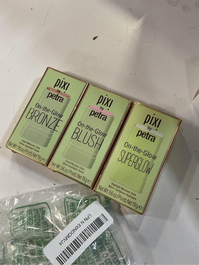 Condition photo showing New/Like New for pixi beauty radiance ready on-the-glow trio | hydrating hydrating tinted moisture stick blush, bronzer, and highlighter set | travel size, vegan, and paraben-free