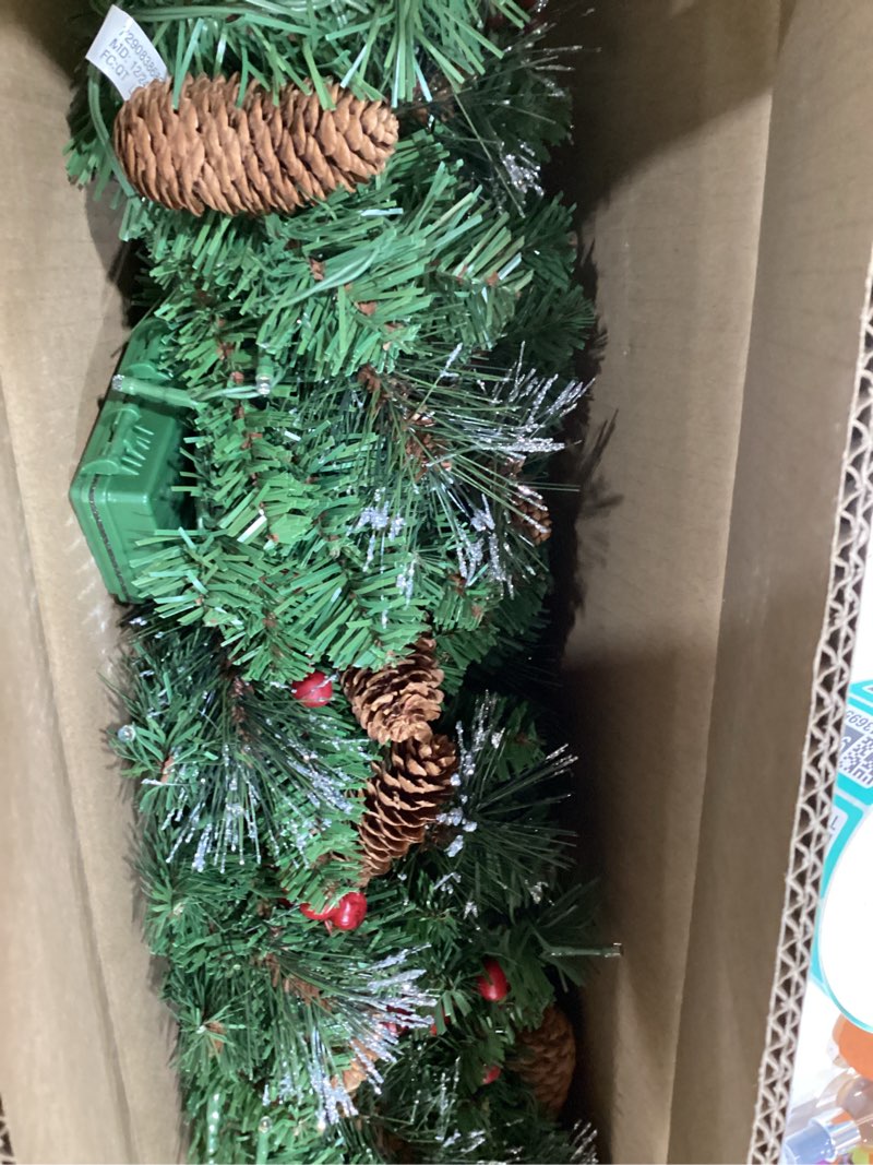 Condition photo showing Good Condition for national tree company 9 ft pre-lit crestwood spruce artificial christmas garland, christmas decoration with glitter, pinecones, red berries, 50 warm white led lights, 180 tips, timer, green battery operated tree