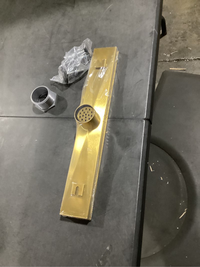 Condition photo showing New/Like New for gold shower drain, 18 inch linear shower drain with removable square hole cover grate, bathroom modern 304 stainless steel brushed gold shower floor drain with adjustable feet,hair filter brushed gold 18in