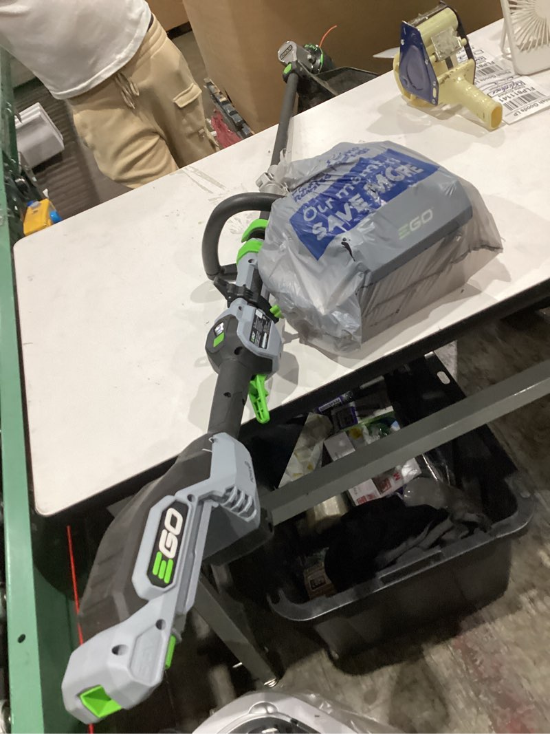 Condition photo showing As Is for ego power + powerload with line iq 56-volt 16-in telescopic shaft battery string trimmer 4.0 ah (battery included) (charger included)