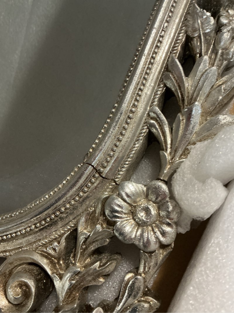 Condition photo showing As Is for Howard Elliott Sherwood Hanging Antique Accent Wall Mounted Mirror, Ornate Arched Mirror with Bevelled Edges and Silver Resin Frame, Arch Shape Mirror for Home, Living Room, Entryway, 14 x 22 Inch Silver Arched