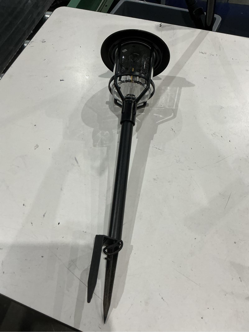 Condition photo showing As Is for harbor breeze 15 -lumens black solar led outdoor path light 3000-k