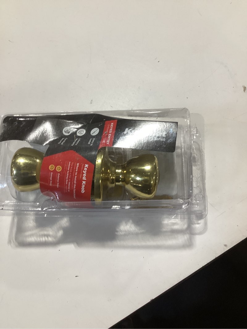 Condition photo showing As Is for kwikset tylo entry door knob with lock and key, secure keyed handle exterior doorlock, doorknob for front entrance and bedrooms in polished brass