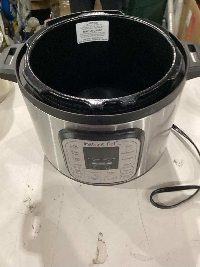 Condition photo showing As Is for instant pot duo 7-in-1 electric pressure cooker, slow cooker, rice cooker, steamer, sauté, yogurt maker, warmer & sterilizer, includes app with over 800 recipes, stainless steel, 8 quart 8 quarts