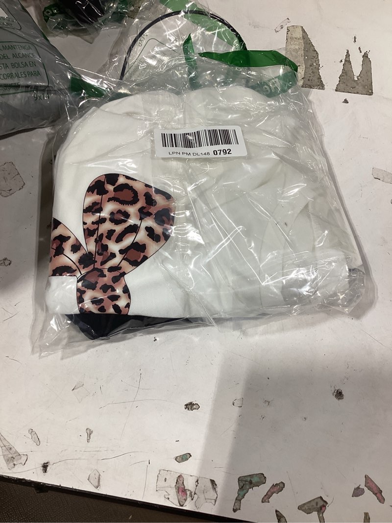 Condition photo showing New/Like New for girls long sleeve sweatshirt 2 piece, bow graphic top and pants spring fall fashion casual clothes. 12 years white