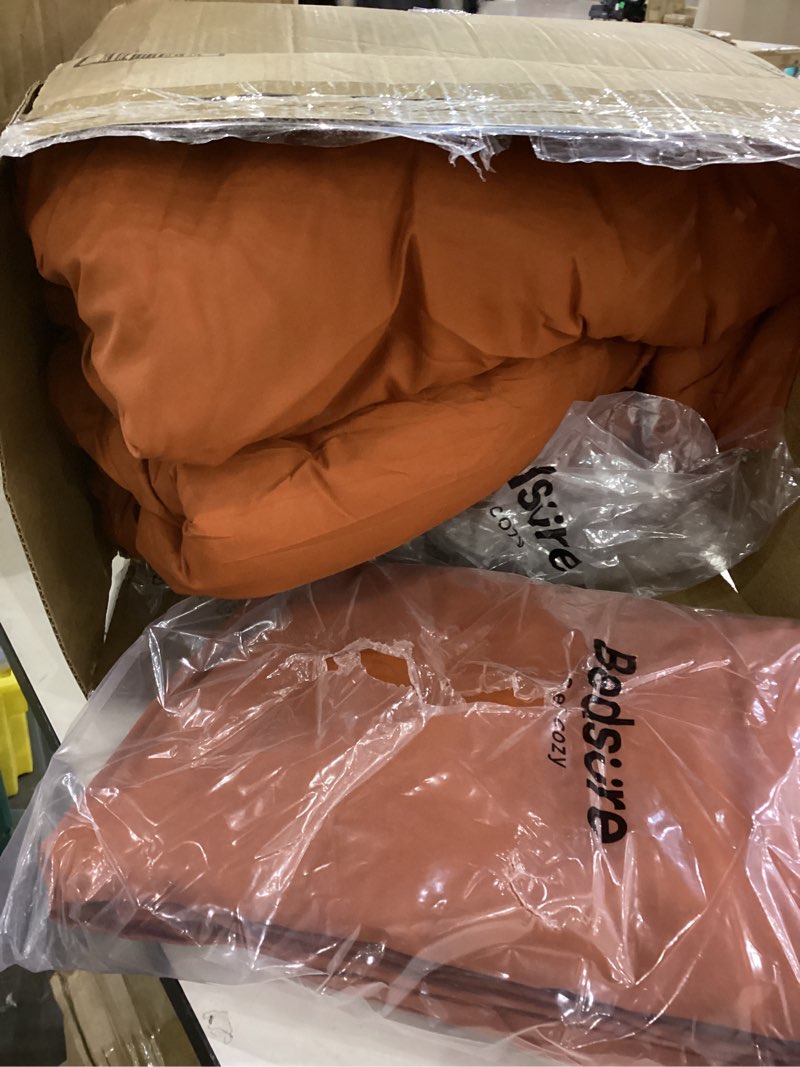 This appears to be a burnt orange comforter or duvet set in its packaging.  