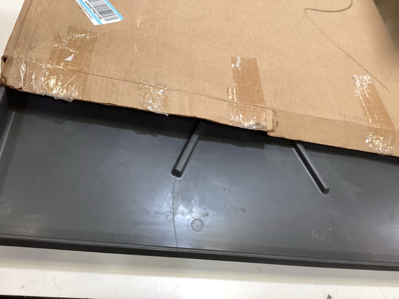 Condition photo showing As Is for camco low profile washing machine drain pan with pvc fitting - 29 inch x 33 inch id and 30.5 inch x 34.5 inch od - protects your floors from washing machine leaks - easy to use - graphite - 20784 standard packaging graphite 30.5" x 34.5"