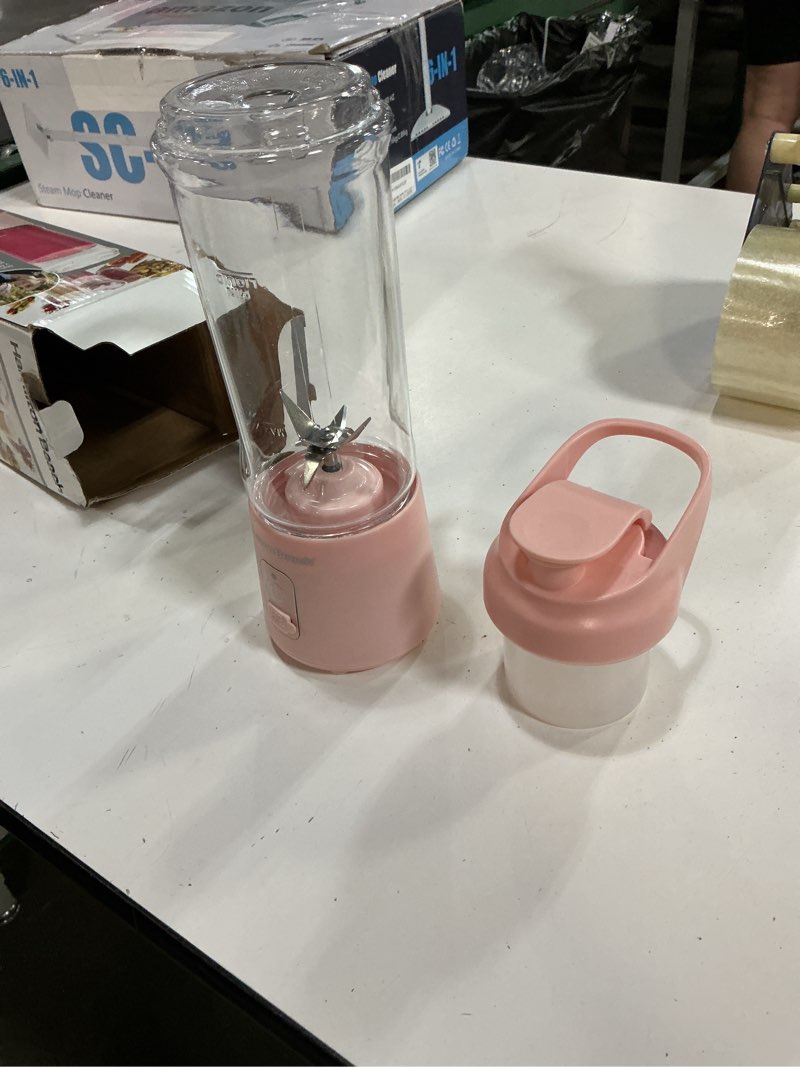 Condition photo showing Good Condition for hamilton beach mini cordless portable personal blender for shakes and smoothies, usb rechargeable, 16 oz. jar with leakproof travel lid, 6 stainless steel blades, pink (51181) pink 16 oz. travel jar