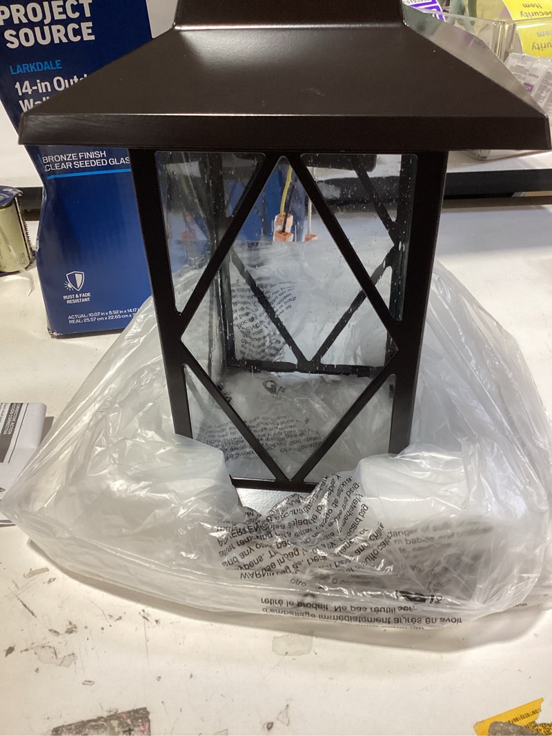 Condition photo showing As Is for project source larkdale 1-light 14.17-in h bronze outdoor wall light