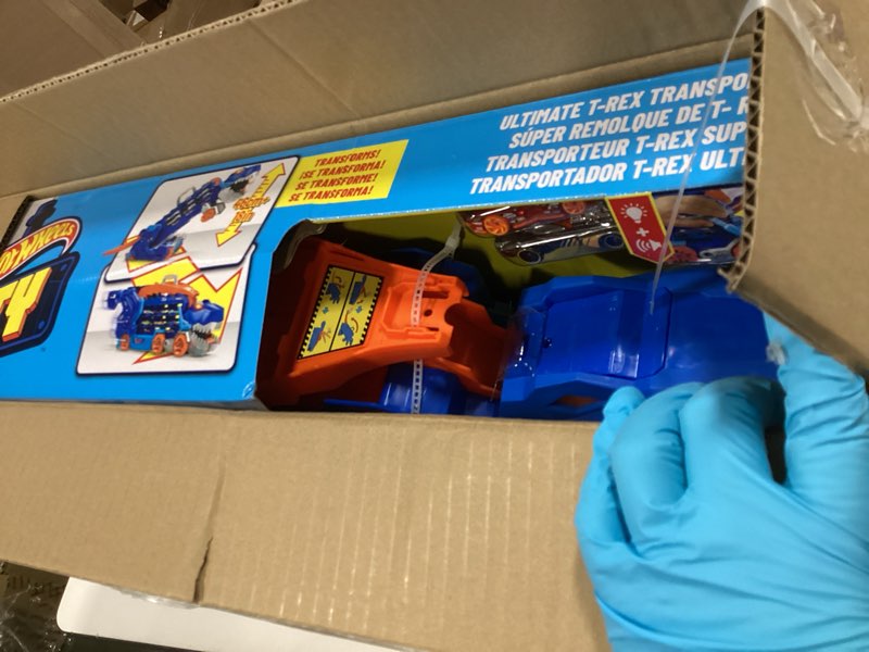 Condition photo showing New/Like New for Hot Wheels City Toy Car Track Set, Ultimate T-Rex Transporter, Hauler Transforms into Stomping Dino with Race Track, from Netflix Series “Let’s Race”