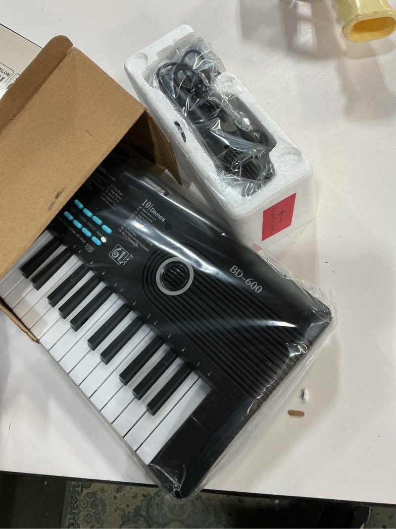 Condition photo showing As Is for 61 key keyboard Piano,Portable Electronic Digital Piano,Built In Dual Speakers,External Microphone,Power Plug,Rich Teaching Content,Multi-Functional Electronic Piano Suitable For Beginners kkek5 black
