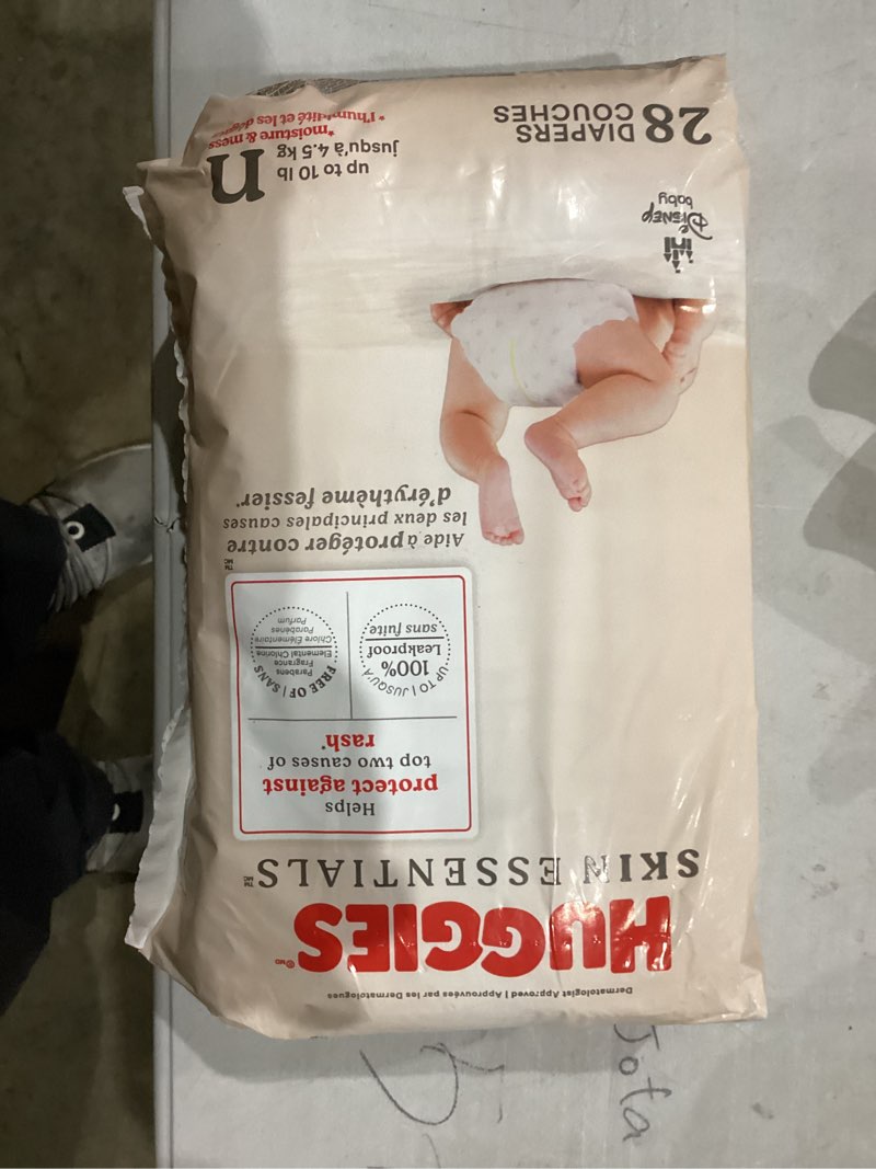 Condition photo showing New/Like New for Huggies Size Newborn Diapers, Skin Essentials Baby Diapers, Size Newborn (6-9 lbs), 28 Count, Packaging May Vary Newborn 28